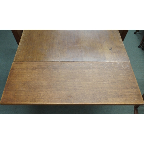 49 - A 20th century French oak dining suite consisting refectory style pull out extending dining table wi... 