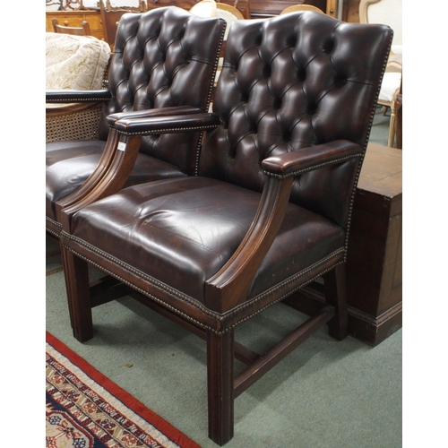 55 - A pair of 20th century Georgian style button back leather upholstered armchairs, 94cm high x 63cm wi... 