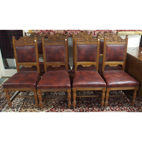 63 - A set of eight Victorian oak dining chairs with burgundy leather upholstered splats and seats on tur... 