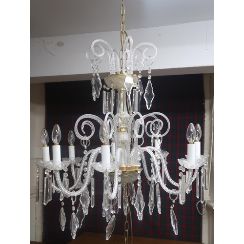 64 - A 20th century Venetian style eight branch chandelier with scrolled glass arms