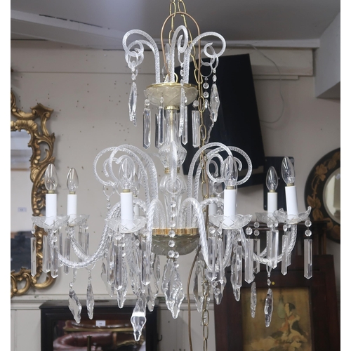 64 - A 20th century Venetian style eight branch chandelier with scrolled glass arms