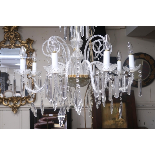 64 - A 20th century Venetian style eight branch chandelier with scrolled glass arms