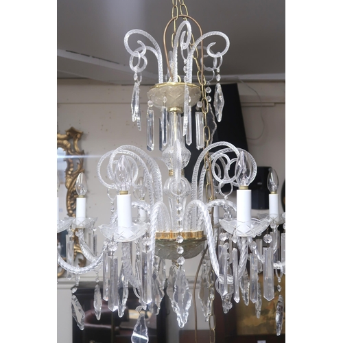 64 - A 20th century Venetian style eight branch chandelier with scrolled glass arms