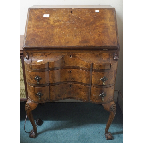 74 - A lot comprising 20th century walnut veneered serpentine front bureau and an oak shallow bureau (2)