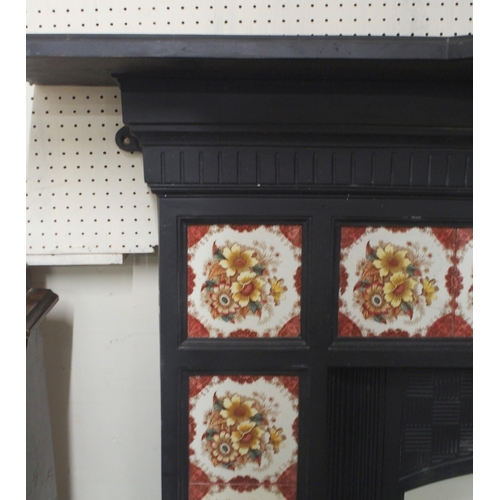 75 - A 19th century cast iron combination fireplace/insert with iron mantle over floral tile inset surrou... 