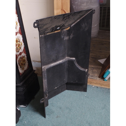 75 - A 19th century cast iron combination fireplace/insert with iron mantle over floral tile inset surrou... 