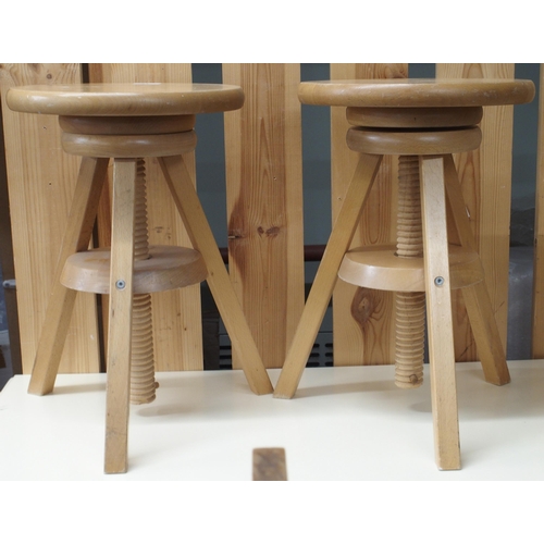 81 - A pair of contemporary beech adjustable sculpture stands, 46cm high x 31cm diameter and a pine frame... 