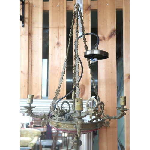 82A - An early 20th century brass Rococo style four branch chandelier with cast brass hanging chains, 69cm... 