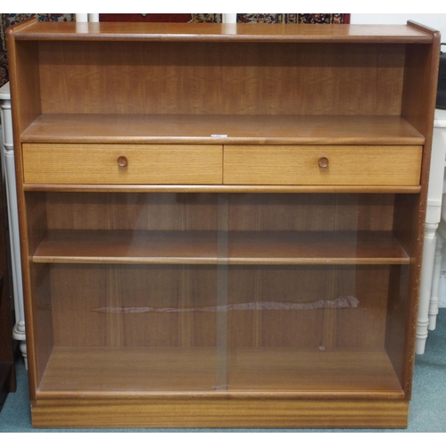 87 - A mid 20th century teak bookcase with open shelf over two drawers over glass sliding doors, 108cm hi... 