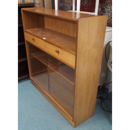 87 - A mid 20th century teak bookcase with open shelf over two drawers over glass sliding doors, 108cm hi... 