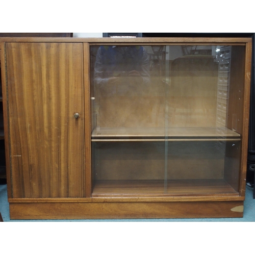 88 - A mid 20th century teak bookcase with cabinet door alongside pair of glazed sliding doors, 78cm high... 