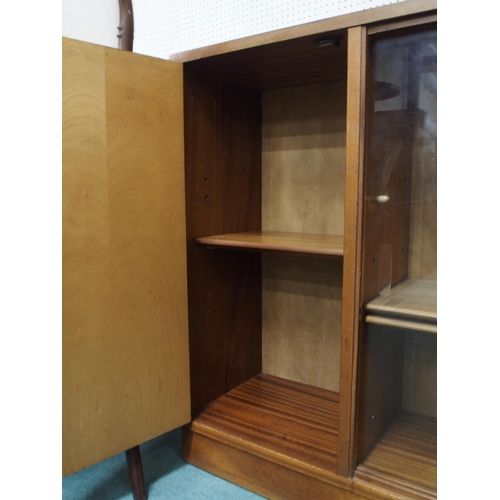 88 - A mid 20th century teak bookcase with cabinet door alongside pair of glazed sliding doors, 78cm high... 