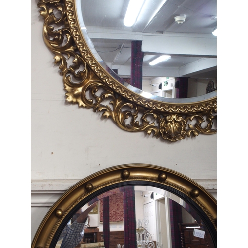 9 - A lot of two assorted circular gilt framed wall mirrors (2)