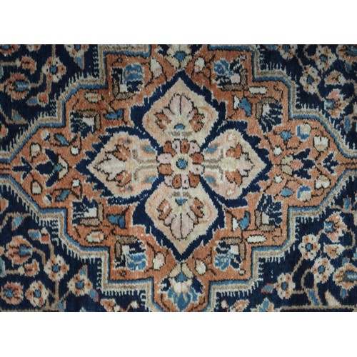 60 - A lot comprising dark blue ground keshan rug with beige central medallion and spandrels, 136cm long ... 