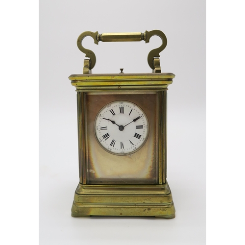 2153 - A LATE 19TH CENTURY GILT BRASS AND GLASS REPEATING CARRIAGE CLOCK the white dial with roman numerals... 