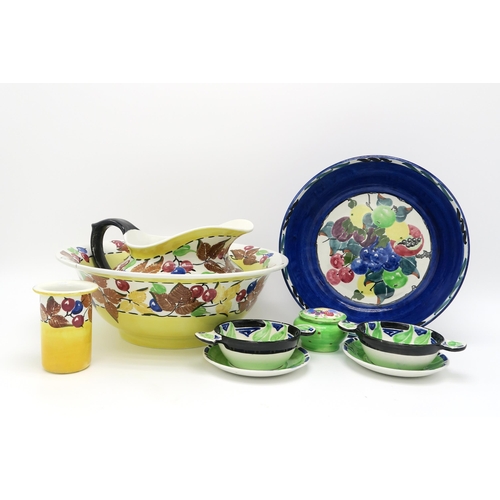 2171 - RICHARD AMOUR FOR BOUGH POTTERYA leaf and berry painted washbowl, ewer and tooth mug, a fruit painte... 