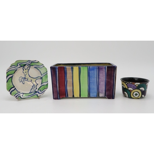 2181 - ELIZABETH MARY WATT (SCOTTISH 1886-1954)A rainbow stripe rectangular planter, a tea plate painted wi... 