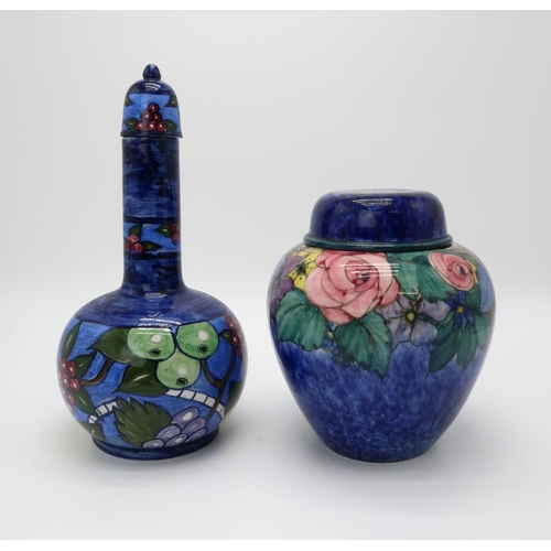 2198 - MARY A RAMSAY FOR STRATHYRE POTTERY GINGER JAR AND COVERthe dark blue ground with painted flower dec... 