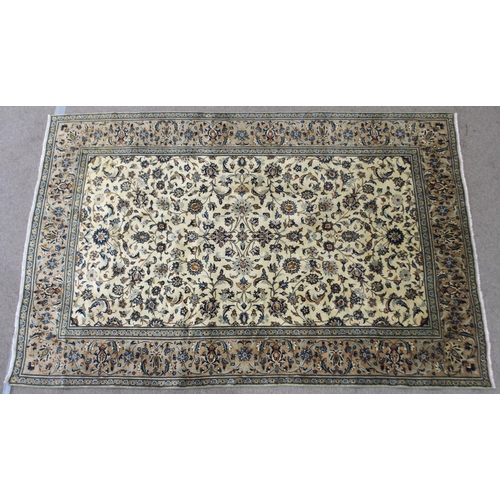 2136 - A CREAM GROUND KASHAN RUGwith all over floral ground and flower head border, 297cm long x 194cm wide... 