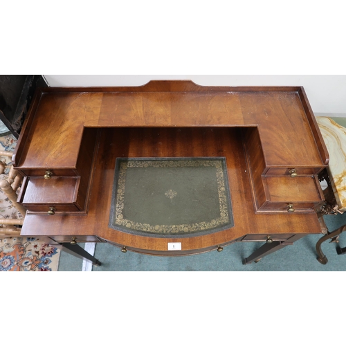 1 - A 20th century reproduction mahogany writing desk with four drawered superstructure over central dra... 