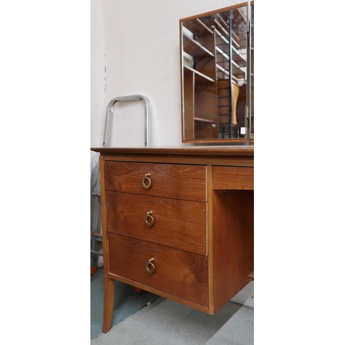 103 - A mid 20th century teak dressing table with triple plate mirror over central drawer flanked by three... 