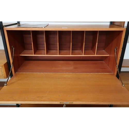 105 - A mid 20th century Staples Ladderax shelving system comprising three room divider uprights, fall fro... 