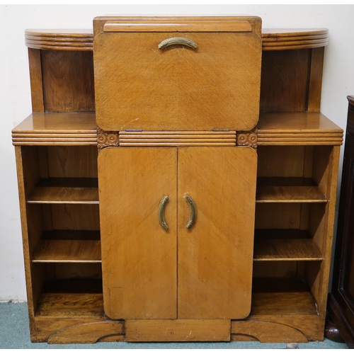 129 - An early 20th century Art Deco cabinet bookcase with central fall front compartment over pair of cab... 