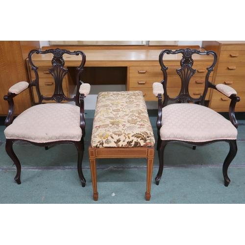 132 - A pair of Edwardian ebonised parlour armchairs and a upholstered bench stool on square tapering supp... 