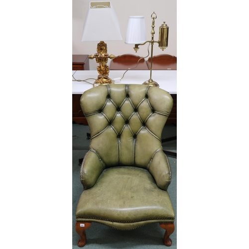 136 - A contemporary green button back leather upholstered lounge chair, gilt figural table lamp in the fo... 