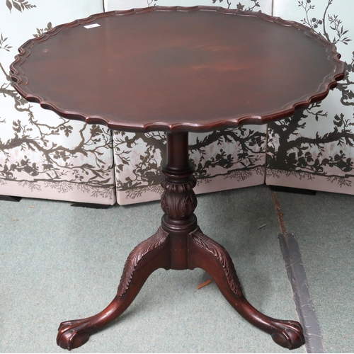 15 - A 20th century mahogany pie crust edge circular tilt top table on tripod base terminating in ball an... 