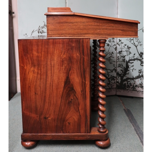 18 - A Victorian rosewood Davenport writing desk with sliding hinged writing slope top concealing fitted ... 