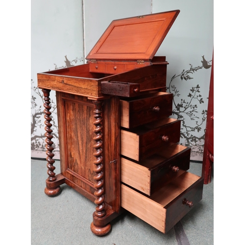 18 - A Victorian rosewood Davenport writing desk with sliding hinged writing slope top concealing fitted ... 