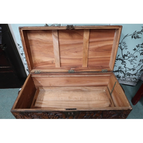 21 - A 20th century Oriental carved camphorwood chest with internal tray on clawed feet, 51cm high x 93cm... 