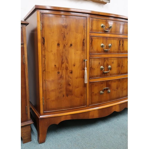 33 - A 20th century reproduction dining suite comprising bowfront sideboard with four central drawers fla... 