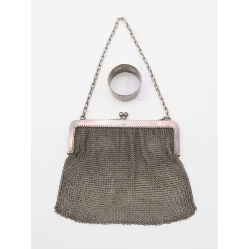 363 - A silver chain mesh purse, with import marks for Paul Ettinger, London, and an EPNS napkin ring (2)