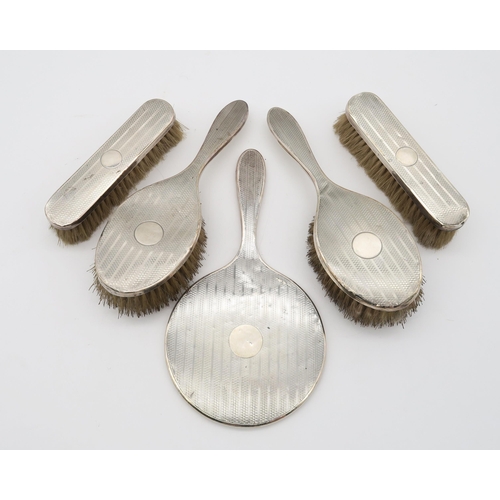 364 - A five piece silver dressing set, by Deakin & Francis, Birmingham 1927, comprising two clothes b... 