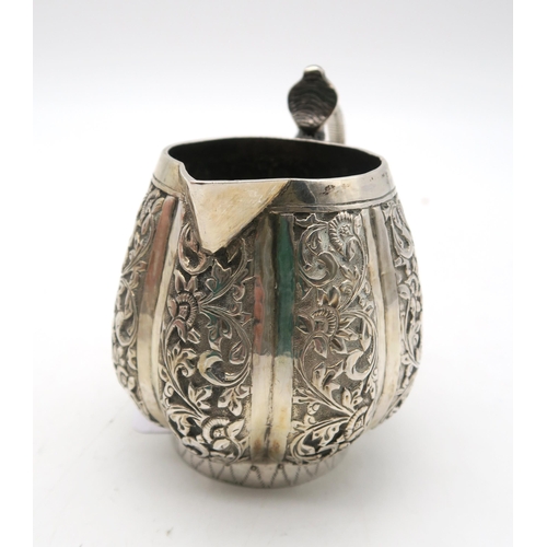 387 - An Indian Kutch silver cream jug, with a cobra handle, and an Indian silver sugar bowl, 157gms (2)