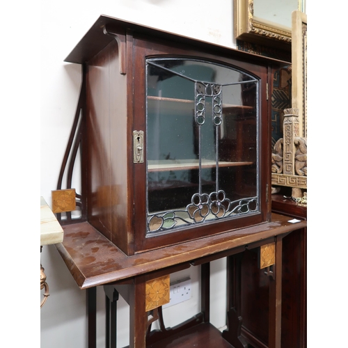 5 - A late Victorian mahogany Arts & Crafts cabinet with single floral stained glass door concealing... 