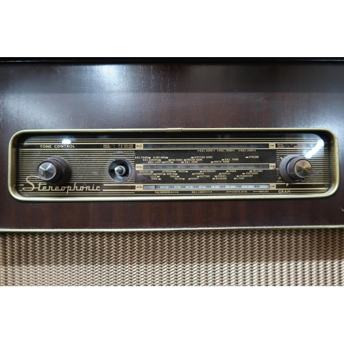 60 - A mid 20th century R.G.D stereophonic radiogram with integrated Monarch turntable, 72cm high x 112cm... 