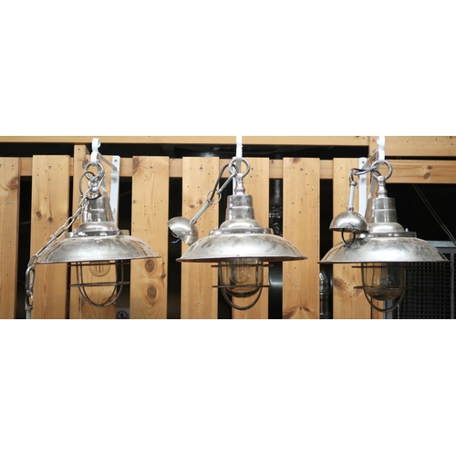 66 - A lot of four 20th century steel shaded harbour style ceiling lights with caged glass shades (one la... 