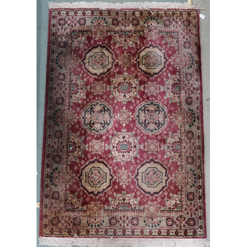 79 - A pink ground Mandalay jute rug with cream lozenge design and cream border, 183cm long x 122cm wide&... 