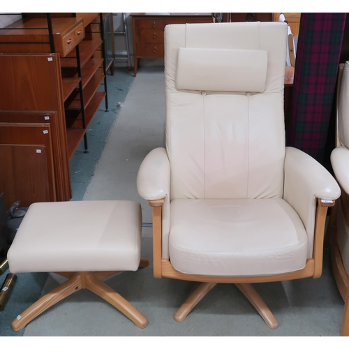 81 - A contemporary beech framed Ercol Gina revolving armchair and accompanying footstool, both upholster... 