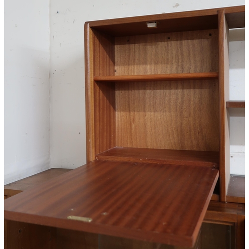 86 - A mid 20th century stained teak wall shelf with fall front cabinet alongside open shelves, 48cm high... 