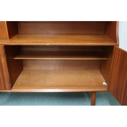 89 - A mid 20th century teak Jentique sideboard with fall front compartment alongside sliding doors over ... 