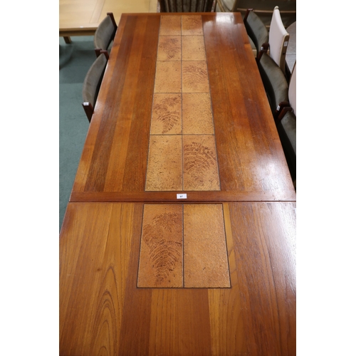 97 - A mid 20th century Danish teak Gangso Mobler extending dining table with tile inset top and leaves, ... 