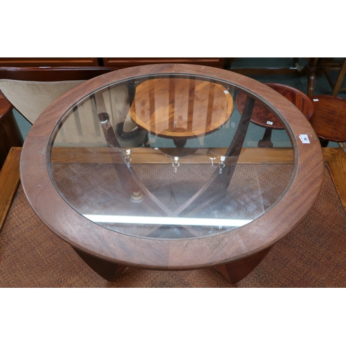 98 - A mid 20th century teak G Plan Astro circular glass inset coffee table on shaped supports, 46cm high... 