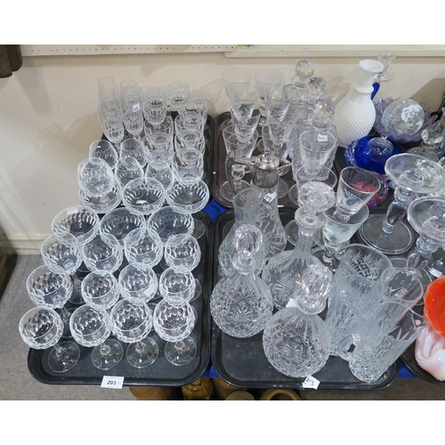 203 - Six Waterford wine glasses, other drinking glasses, a pair of crystal decanters, a set of three deca... 