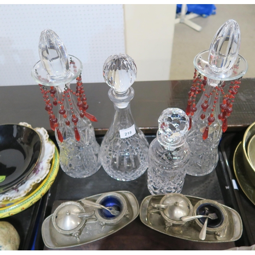 218 - A pair of crystal decanters, other decanters, cruets etc