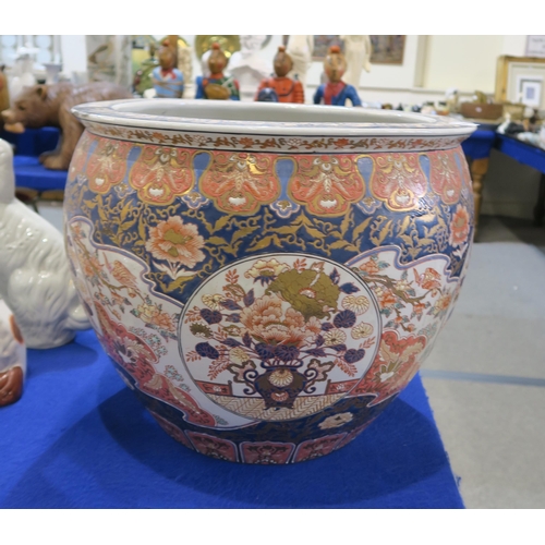 269 - A large Chinese fish bowl, decorated with urns of flowers