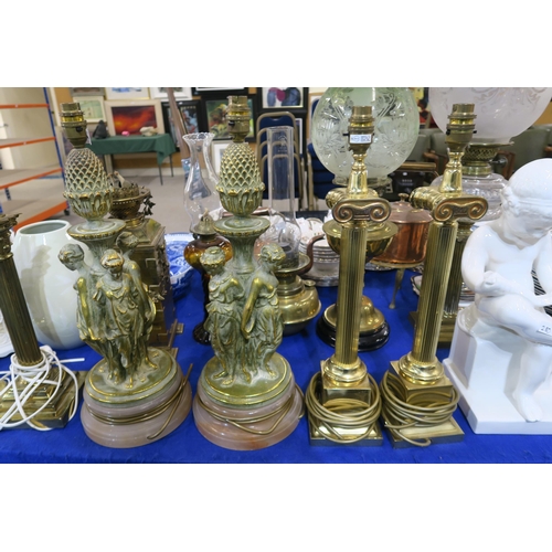 280 - A pair of gilded lamps modelled as classical maidens, together with a pair of brass column table lam... 